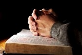 3102870-bible-praying-hands-man